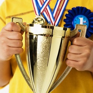 Child Holding Trophy